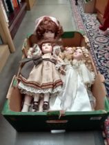 A quantity of porcelain headed collectors dolls