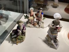 A Crown Derby figure and two other porcelain figures.