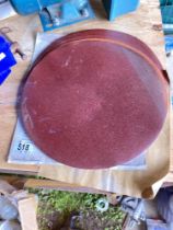 A quantity of large sanding / abrasive discs