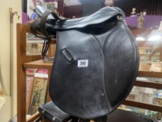 A Paul Jones 17" GP Saddle measured button to cantel, width unknown, includes stirrups and safety