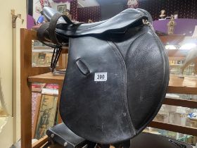 A Paul Jones 17" GP Saddle measured button to cantel, width unknown, includes stirrups and safety