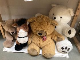 A collection of teddys and a horse
