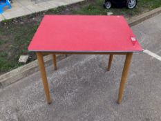A red formica vintage kitchen table