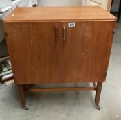 A vintage teak hifi cabinet on castors COLLECT ONLY.