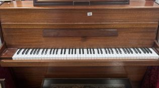 A mahogany upright piano in working condition. COLLECT ONLY
