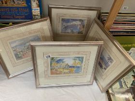 A set of 4 unusual style prints in silver coloured frames