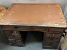 A Mahogany twin pedestal clerks desk with brown leather top comes apart to transport brass