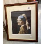 A framed and glazed print of a lady, Girl With Pearl Earring.