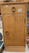 An oak bedside cabinet