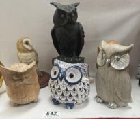 A quantity of ceramic & wooden owls