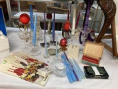 A varied selection of candles & candle holders
