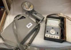 A camera flash unit, volt meter etc