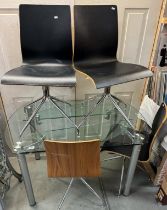 A Scandinavian style glass extending (canter-lever) table with four bentwood and vinyl covered