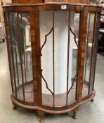 A bow fronted Astral glazed China cabinet with two shaped glass shelves on Queen Anne style legs 120