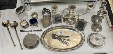 A quantity of silver plate items including frames, candlesticks etc