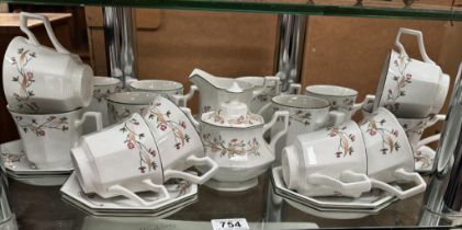A 16 piece tea set with milk jug & sugar bowl with 6 matching mugs