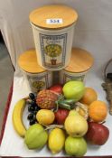 A set of 'Oranges & Lemons' Tea, coffee & Sugar cannisters & A quantity of plastic fruit