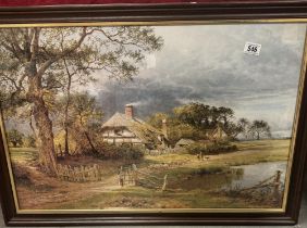 A large framed & glazed print of a period thatch cottage scene