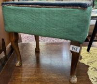 An Upholstered footstool