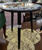 A mirror topped side table