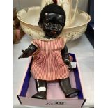 A vintage Pedigree black baby doll