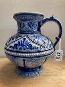 A blue glazed stoneware jug