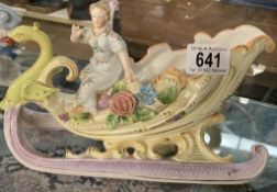 A Porcelain lady in swan carriage