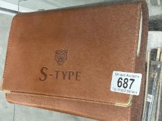 A Jaguar S-Type drivers handbook in leather folder