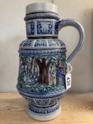 A blue glazed stoneware jug