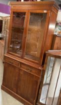A reproduction mahogany effect display dresser, glazed etched doors with two drawers and cupboards