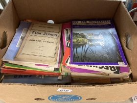 A large box of sheet music books
