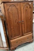A Ducal pine wardrobe with hanging rail and drawer. 145 x 87 x 53cm