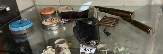A chromed luger cigarette lighter in holster, bullet shells & 4 tins of air rifle pellets