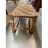 A Long foot stool with rope twist top