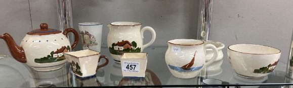 A quantity of Torquay ware items including teapots, milk, sugar etc