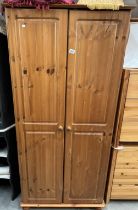 A solid pine double door wardrobe