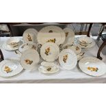 A 21-piece bone China dinner set featuring yellow roses.