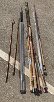 A quantity of vintage fishing rods and thumb stick