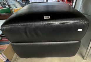 A large, black leatherette stool / storage box