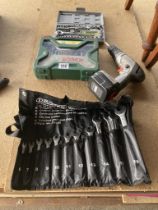 A Bosch drill bits set, small socket set, Draper spanners wrap, and a black and decker Drill no