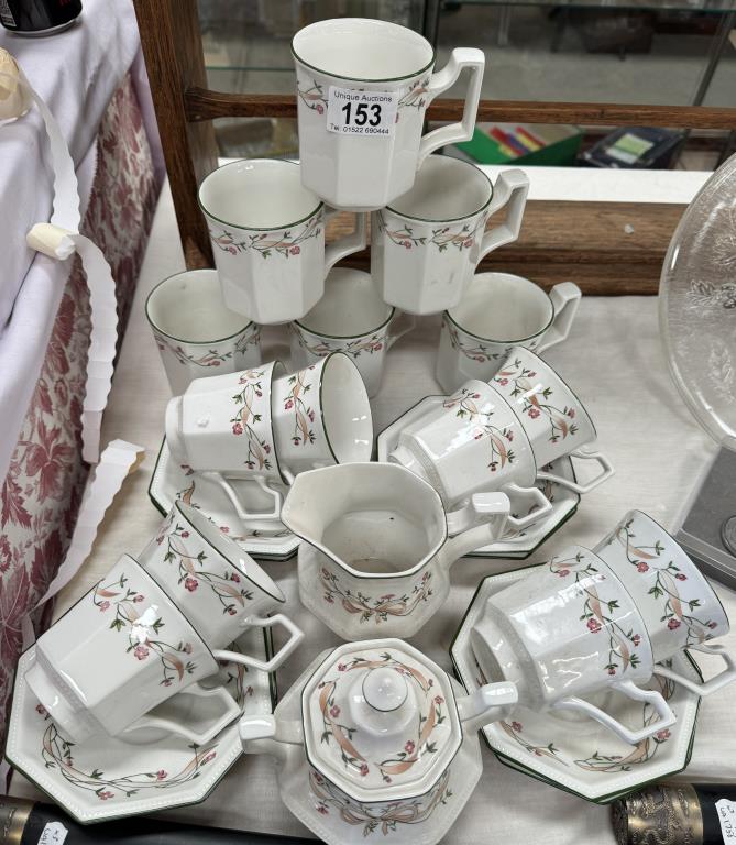 A 16 piece tea set with milk jug & sugar bowl with 6 matching mugs