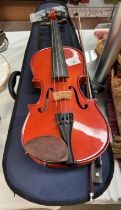 A 3/4 size violin with a bow & hard carry case
