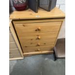 A 4-drawer pine effect chest 66 x 41 x 89cm