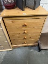 A 4-drawer pine effect chest 66 x 41 x 89cm