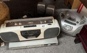 A DVD player, Sony tape, radio player, Cd/ tape player, & 2 speakers