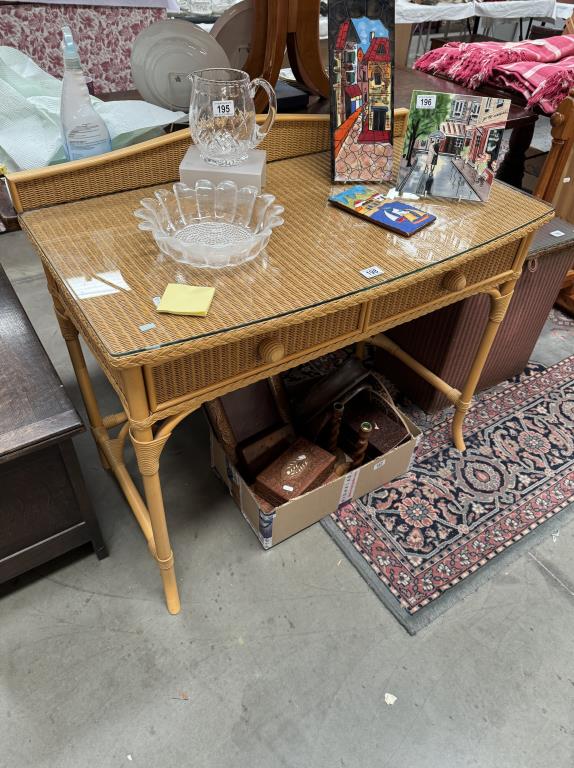 A bamboo with Lloyd loom style top dressing table