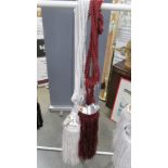 A pair of red wine curtain tie backs with gem style embellishment and tassels [1 slightly lighter