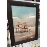 A glazed African waterside hut scene with wicker effect frame. 64 x 85cm
