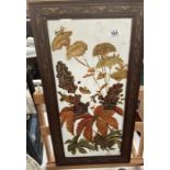 A floral still life painted on white glass in a decorative frame signed NN. 36 x 68cm