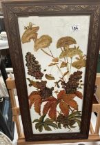 A floral still life painted on white glass in a decorative frame signed NN. 36 x 68cm